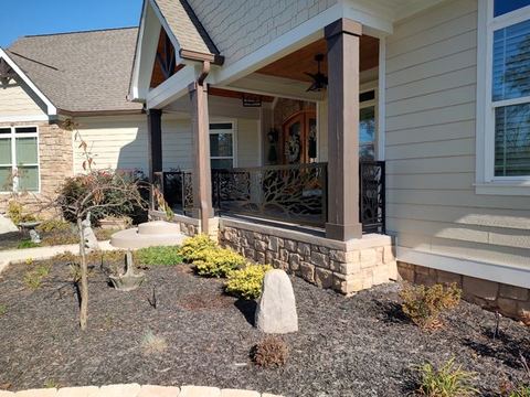Custom steel railing fabricated, painted and installed for front porch.